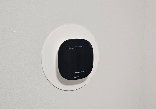 Smart thermostat on wall